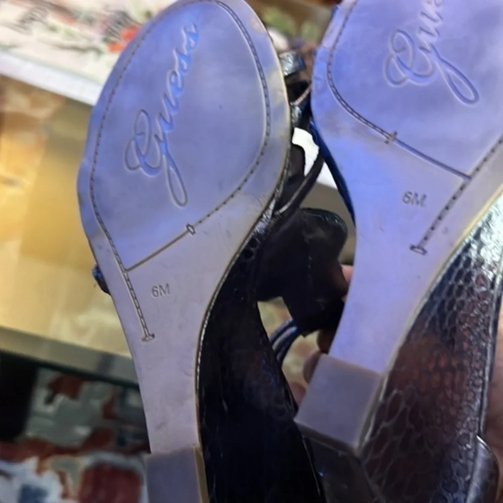 Guess heels about to 4inches, big rhinestones , bright and shiny